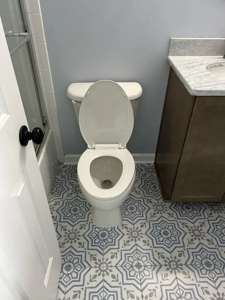 New toilet set on patterned tile
