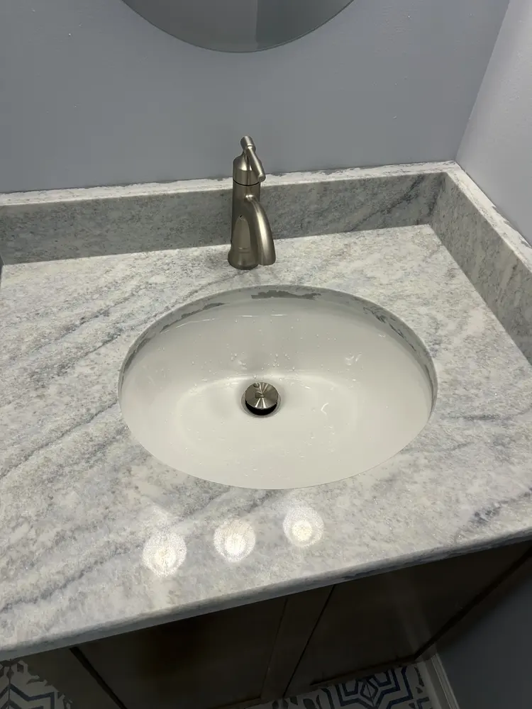 Brushed nickel faucet on an undermount vanity sink
